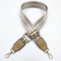 Detail of adjustable khaki nylon bag strap with white arrow embroidery and golden hooks - Light Khaki