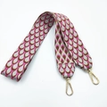 Close-up of pink and brown fish scale pattern jacquard bag strap with gold lobster clasps - Rose Pink