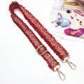 Detail of red and white tweed braided strap with gold hardware and fringe edges - Gold Buckle / Red