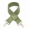Macro shot of adjustable olive green woven shoulder strap with light gold metal lobster clasps - Bean Green