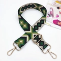 Close-up of geometric embroidered bag strap with premium gold metal lobster clasps - Gold Buckle / Black Beige Green