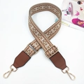 Detail of vintage geometric woven bag strap with brown leather ends and gold metal hooks - Brown Base with Khaki and Brown