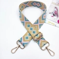 Detail of colorful geometric woven bag strap with golden metal lobster clasps and buckle - Pink Blue Khaki