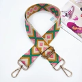 Detail of adjustable wide colorful woven strap with geometric jacquard and golden lobster clasps - Yellow Pink Green