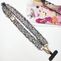 Detail of colorful woven phone strap with golden metal clasp and multi-color fringe design - Pinkish Blue With Gasket