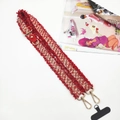 Detail of red and white woven phone strap with golden metal hooks and leather trim - Red With Gasket