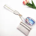 Detail of multi-functional wristlet bag set with cream leather and transparent pouch - Light Gold Arrow