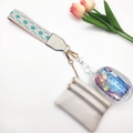 Detail of bohemian woven strap and beige lychee pattern double zipper coin purse with charms - Teal Diamond