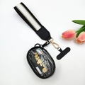 Detail of portable wristlet wallet with striped woven strap and transparent card slot - Black and White Gold Thread
