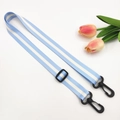 Detail of adjustable light blue striped strap with durable black plastic rotating hooks - Light Blue + Black Buckle