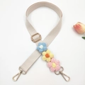 Detail of adjustable beige bag strap with handmade 3D crochet flowers and gold hooks - White Strap With Multi-color Flowers