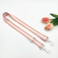 Close-up of adjustable pink and white striped strap with durable white plastic hooks - Light Pink + White Buckle