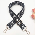 Detailed view of woven geometric diamond strap with gold metal lobster clasps - Black Base Grey Bow