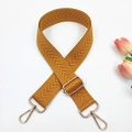 Detail of adjustable ginger yellow bag strap with V-shaped herringbone weave and gold buckle - Yellow