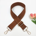 Close-up of caramel brown chevron patterned bag strap with golden metal swivel hooks - Brown