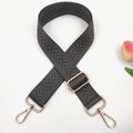 Detail of dark grey adjustable shoulder strap with herringbone pattern and gold buckles - Dark Gray