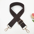 Detail of dark brown 3.8cm replacement strap with herringbone weave and gold hooks - Brown