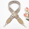 Detail of bohemian jacquard bag strap with leaf pattern embroidery and gold metal hooks - Beige Base Khaki
