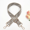 Detail of adjustable 3.8cm wide woven guitar strap with vintage geometric patterns - Beige Base Dark Khaki
