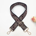 Detail of bohemian red and black geometric woven bag strap with gold metal hooks - Black Wine Red