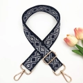 Detail of adjustable geometric navy blue fabric bag strap with golden lobster clasps - Black base Old Blue