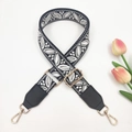 Detail of adjustable wide shoulder strap with black and white floral leaf embroidery - Black Background Gray