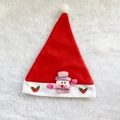Detail of red Christmas hat featuring a 3D snowman doll and holly leaf decorations - Adult Snowman