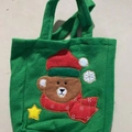 Green felt Christmas gift bag featuring a cute cartoon bear and festive embroidery - Green Bear Style