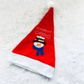 Detail of red Christmas hat with snowman embroidery and Merry Christmas text on plush rug - Snowman Hat