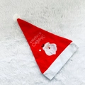 Detail of red plush Christmas hat with white fur trim and Merry Christmas embroidery - Santa Claus Hat