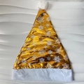 Detail of shiny gold Christmas hat featuring white snowflake patterns and plush trim - Gold (New Snowflake)