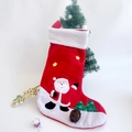 Detailed view of 3D Santa Claus and star embroidery on classic red Christmas stocking - Red Santa Claus Patch Embroidery