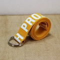 Cintura in nylon canvas giallo zenzero con fibbia a doppio anello a D in metallo e stampa H PROJ - Sfondo Giallo Testo Bianco