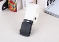 Close-up of white woven nylon belt with black matte metal automatic buckle detail - White