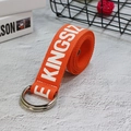 Close-up of orange nylon canvas belt with double D-ring buckle and Kingsize print - Orange
