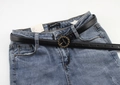 Detail of a thin black leather belt with a vintage round woven metal buckle on jeans - Black