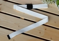 Detail of high-density white nylon canvas belt with black plastic buckle on wood - 120cm / White