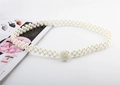 Close-up of elegant double-row pearl waist chain with a sparkling beaded round buckle - Round Pearl Silver Buckle Pearl Belt