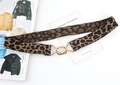 Detailed close-up of leopard print elastic belt with gold double-ring interlocking buckle - Small Figure-8 Buckle / Leopard Print