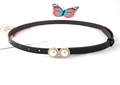 Detailed close-up of thin black waist belt featuring gold dual pearl and rhinestone buckle - 2 Pearls Rhinestone / Black