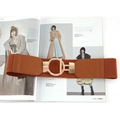 Brown elastic waist belt with gold round buckle on fashion magazine for coat styling - Camel
