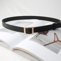 Detailed shot of black slim leather belt with matte gold square buckle on a magazine - Pearl Gold Buckle (Black)