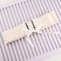 Cintura a corsetto elastica crema con fiocco intrecciato e bordi a volant - Bianco