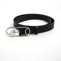 Close-up of black leather belt featuring a unique silver safety pin metal buckle design - Safety Pin Buckle / Black