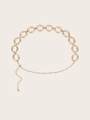 Detail einer Vintage-Metall-Taillenkette in Gold mit gedrehten Ringen und Karabinerverschluss - Gold