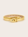 Detailed macro view of a thin gold leather belt with a stylish metallic knot-shaped buckle - Gold
