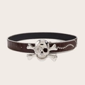 Detail van de bruine punk riem met krokodillenmotief en schedel gesp ingelegd met kristallen - Schedel Kraalgolf Klinknagel (1361) / koffiekleur