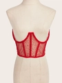 Detailaufnahme des roten Pailletten-Mesh-Korsett-Tops mit stützender Fischgrätenstruktur - Rot