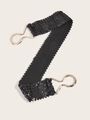 Dettaglio della cintura elastica con paillettes nere e chiusura a gancio in metallo dorato - Nero