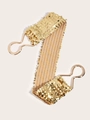 Dettaglio di una cintura elastica con paillettes dorate e gancio in metallo da donna - Oro